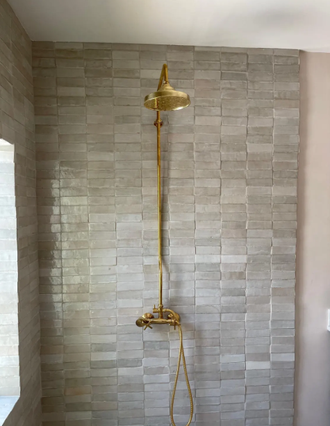 unlacquered brass shower system, handheld shower and shower head combo, exposed pipe