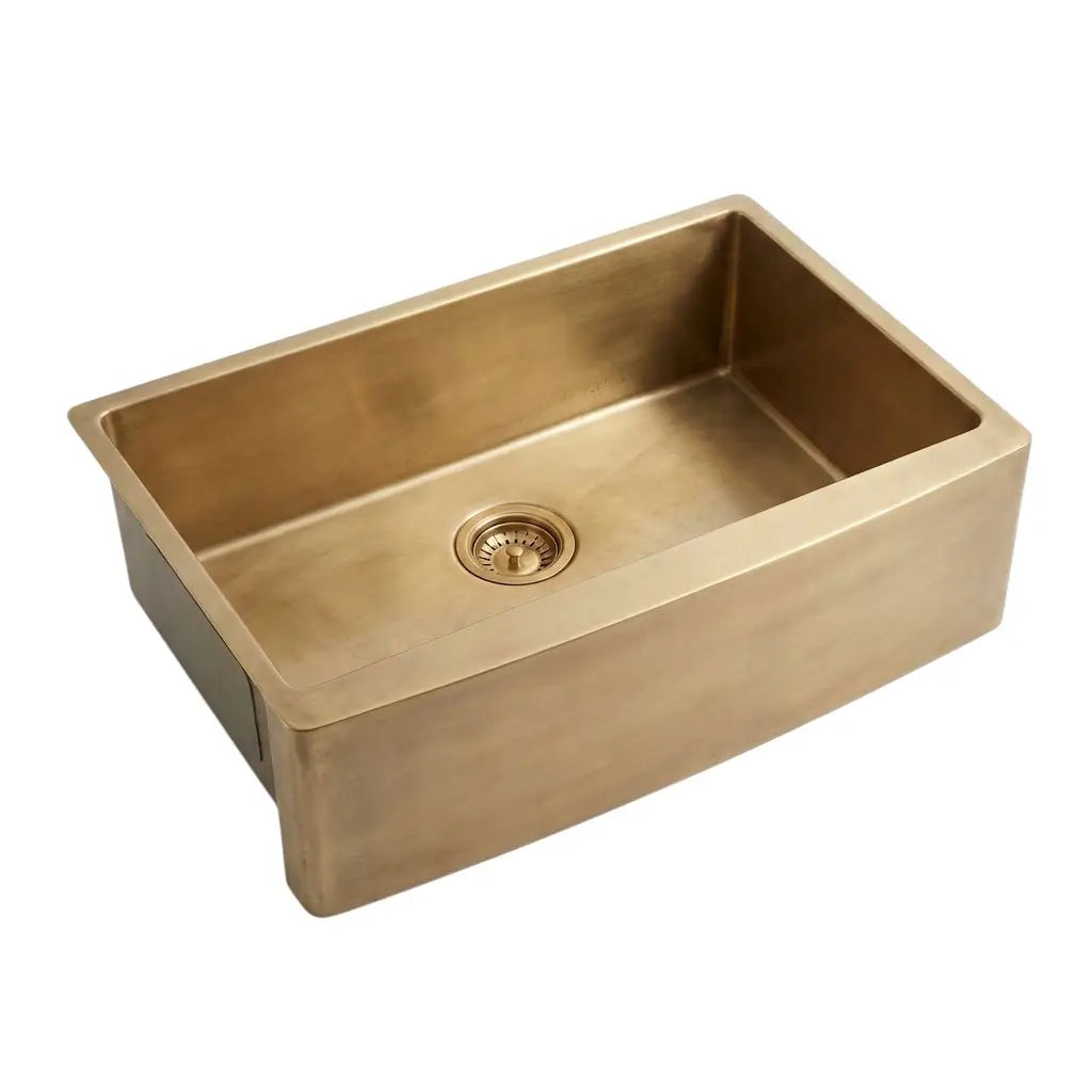 A 30 inch antique unlacquered brass single bowl farmhouse sink showcasing its deep basin design and center drain opening against a plain background.