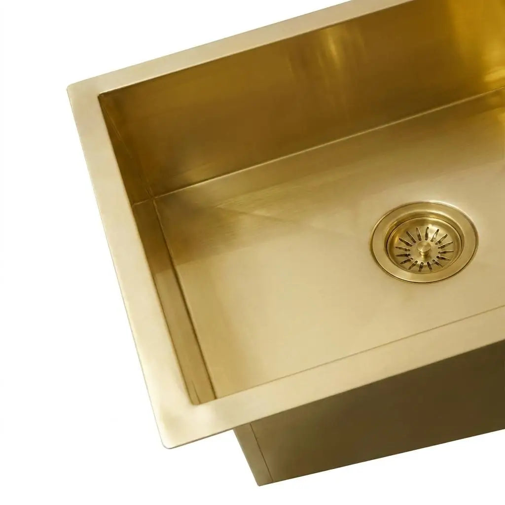 Close up of 30 inch smooth copper kitchen sink basin showing tight radius corners and standard drain