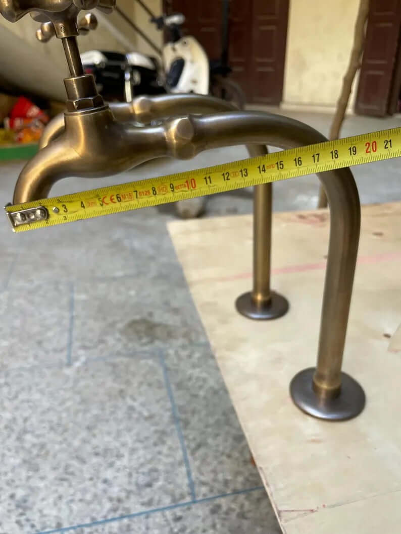 Premium unlacquered brass water dispenser faucet with measuring tape, showcasing its craftsmanship and height.