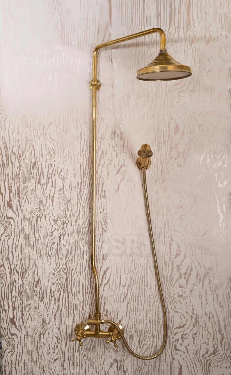 Unlacquered brass shower system with rain head and handheld sprayer, vintage-inspired bathroom fixture.
