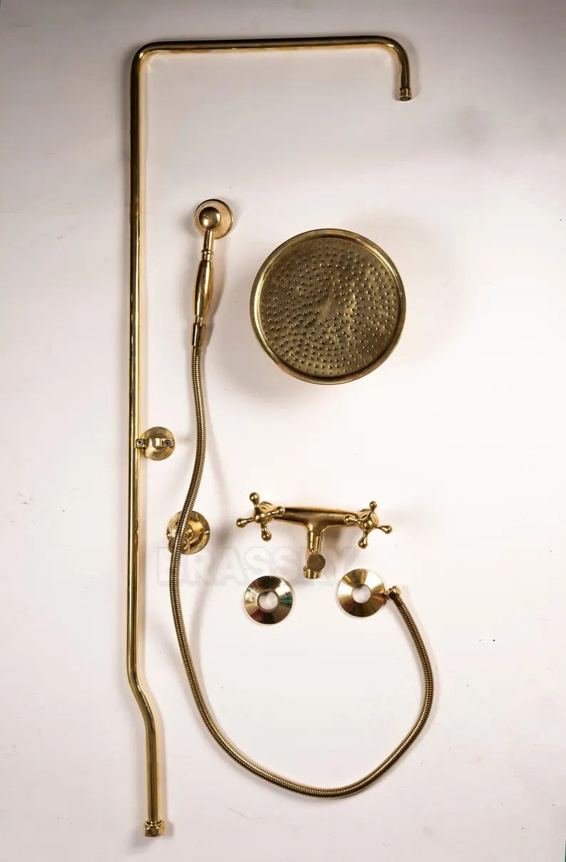 Unlacquered brass shower system with rain head, handheld sprayer, and classic dual-handle controls.