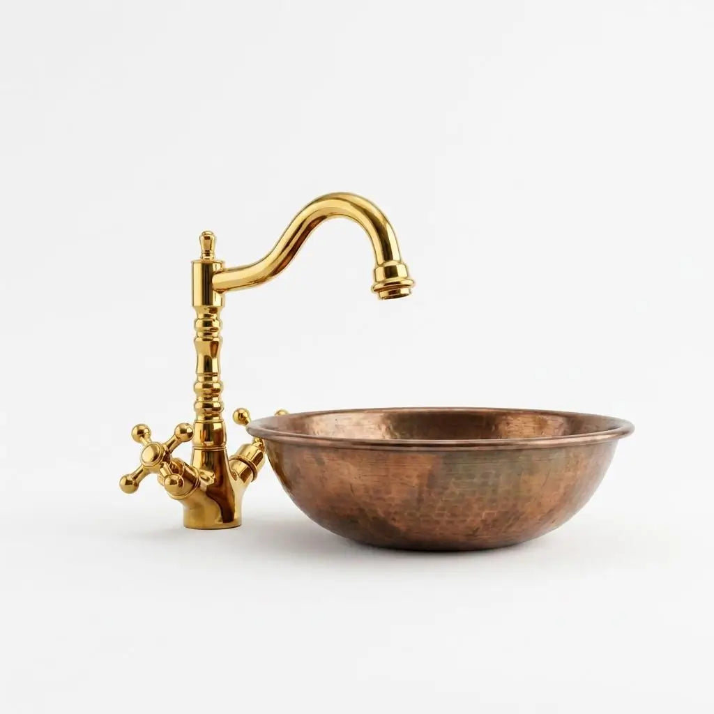 Handmade solid brass faucet paired with a copper basin bowl isolated on a clean white background.