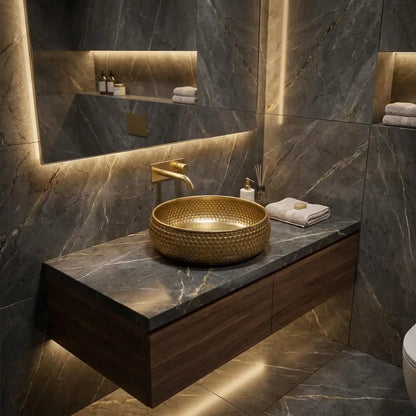 Brushed copper bathroom sink handmade 14x6 inch honeycomb texture vessel basin installed on a dark marble countertop in a luxury vanity setup.