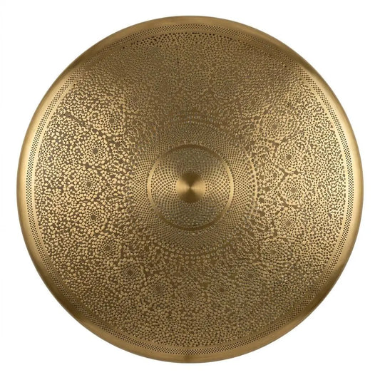 Close-up view of a circular hand-carved brass lamp shade displaying intricate geometric filigree patterns on a white background.