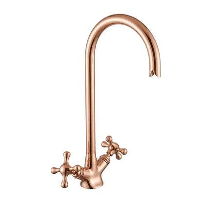 Isolated studio shot of a copper gooseneck faucet with dual cross handles on a plain white background.