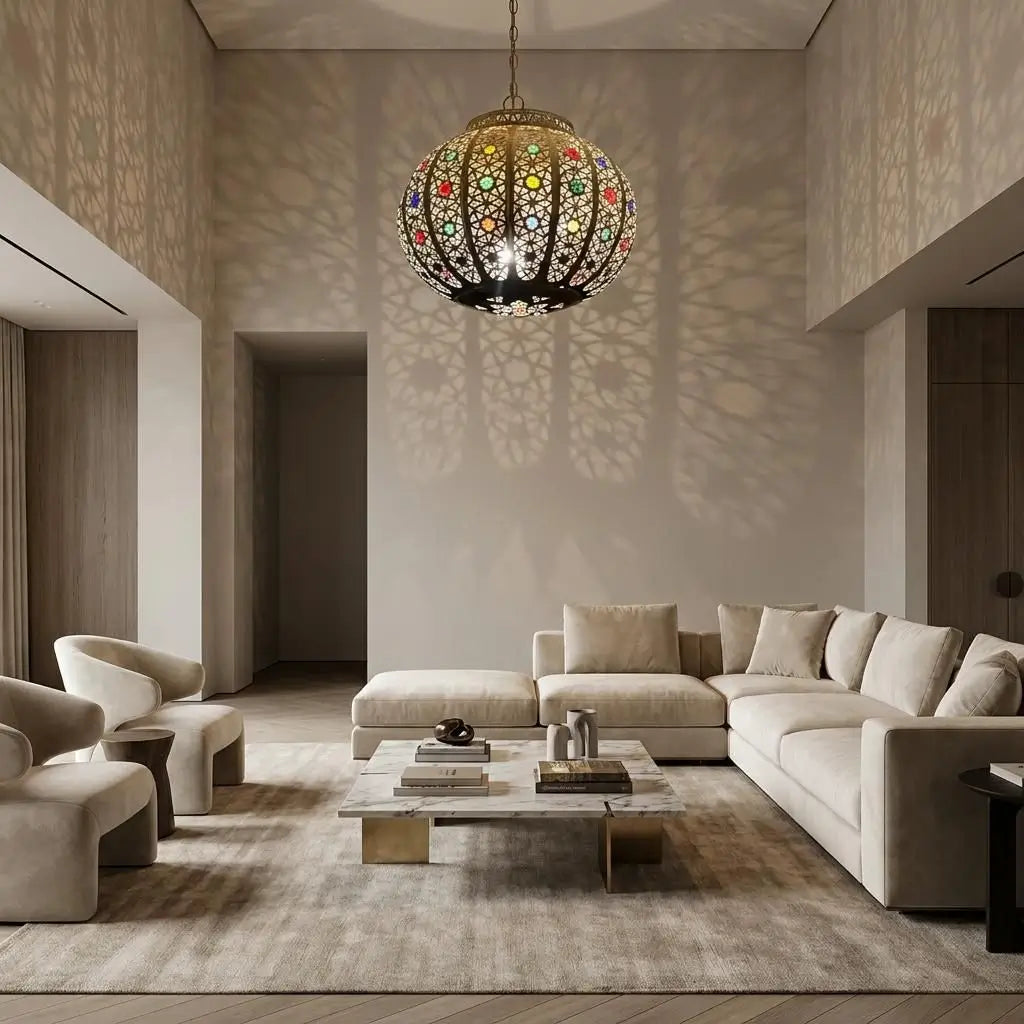 Vintage Moroccan style brass ceiling light fixture with colorful glass hanging in a modern living room with smooth grey walls and cozy white furniture.