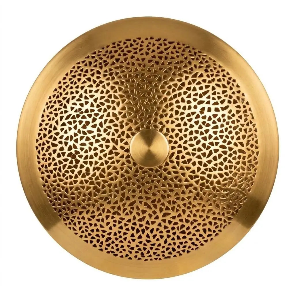 Close-up of a Moroccan wall light showing handmade artisan brass lighting with intricate perforated pattern and textured round metal design.