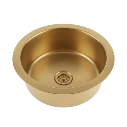 Top view of a round brushed brass drop-in sink with an integrated drain strainer isolated on a clean white background