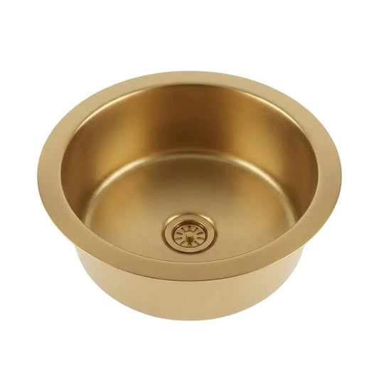 Top view of a round brushed brass drop-in sink with an integrated drain strainer isolated on a clean white background