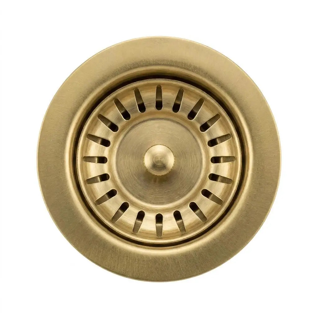 Close-up top view of a standard 3.5 inch solid brass kitchen sink waste disposal flange with a removable slotted strainer basket on a white background.
