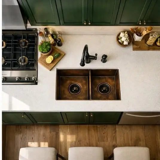 Top view of handmade double vessel copper kitchen sink basin with oil rubbed bronze faucet in modern kitchen countertop