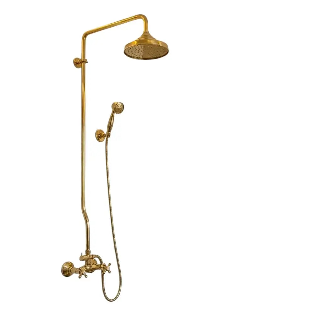 Unlacquered brass exposed pipe shower system featuring a large dome rainfall shower head, handheld sprayer, and cross handles isolated on a white background.