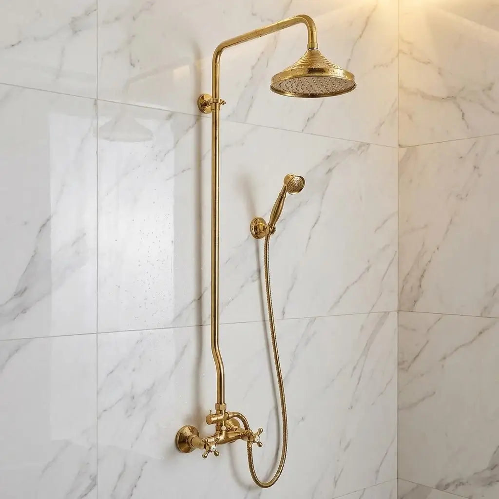 An exposed unlacquered brass shower system featuring a Moroccan rain head and matching handheld spray wand on a clean marble backdrop.